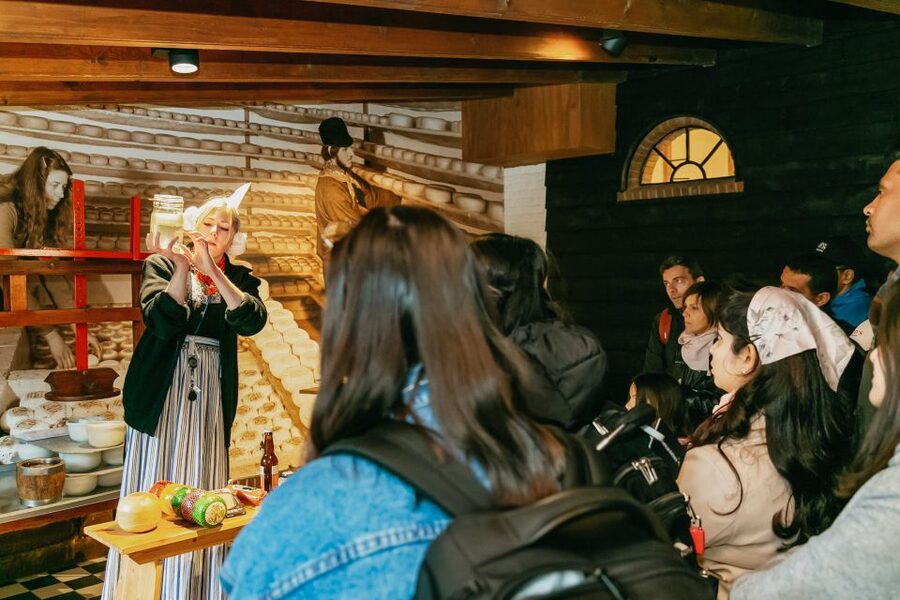 Amsterdam: Zaanse Schans windmills & Volendam Guided Tour - Transport, group size, and the real pace