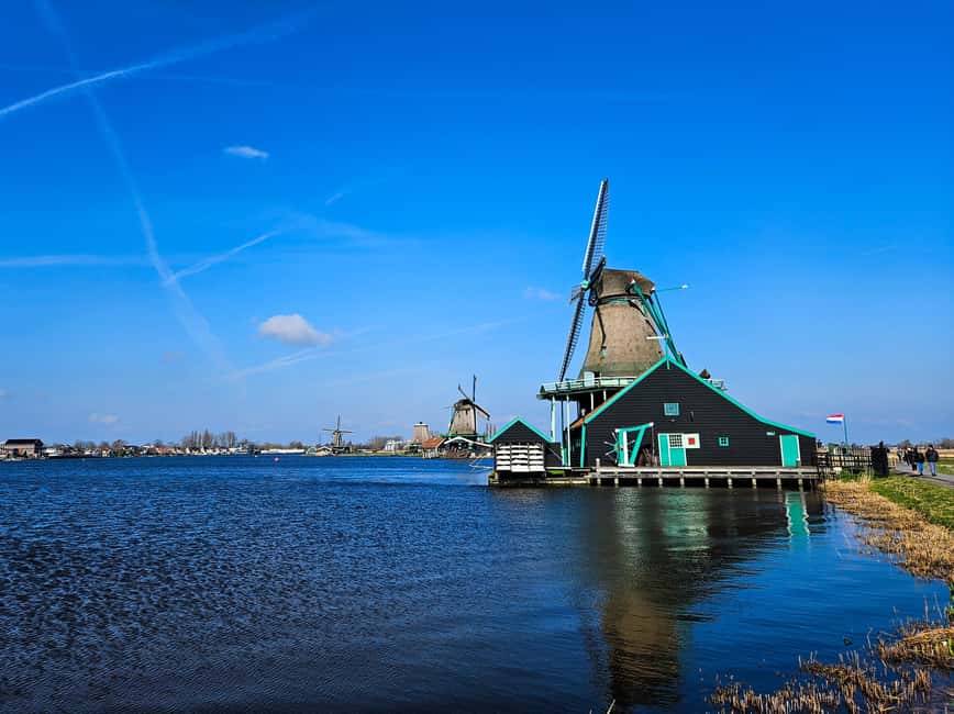 Amsterdam: Zaanse Schans windmills & Volendam Guided Tour - Volendam, dikes, churches, and lake views