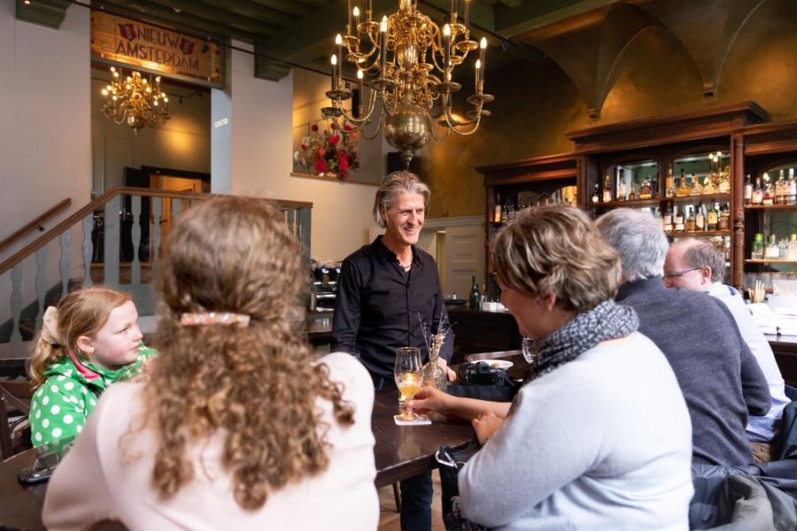 Boutique Dutch Food & History Tour with up to 8 guests only - Walking through the Jordaan between bites