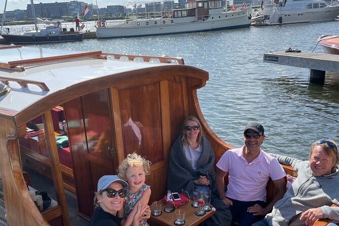 Cruise Amsterdam like a Local — Small Group 12 pax - Settling into the heated saloon boat