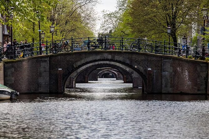 Highlights and Local Insights Canal Cruise Tour in Amsterdam - City Hall and the dancing houses of Rokin