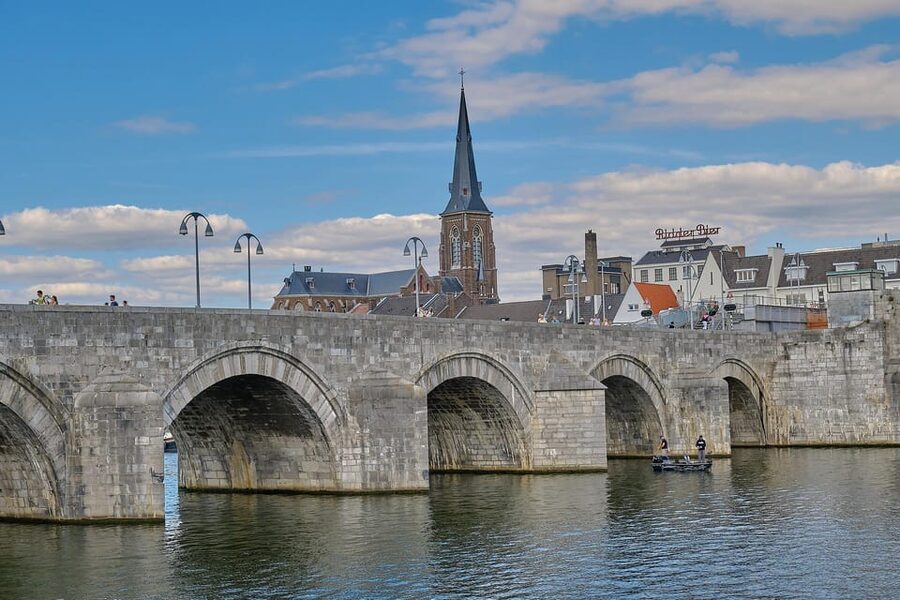 Maastricht: Day trip from Amsterdam with 3 country point - Entering Maastricht through its old gate