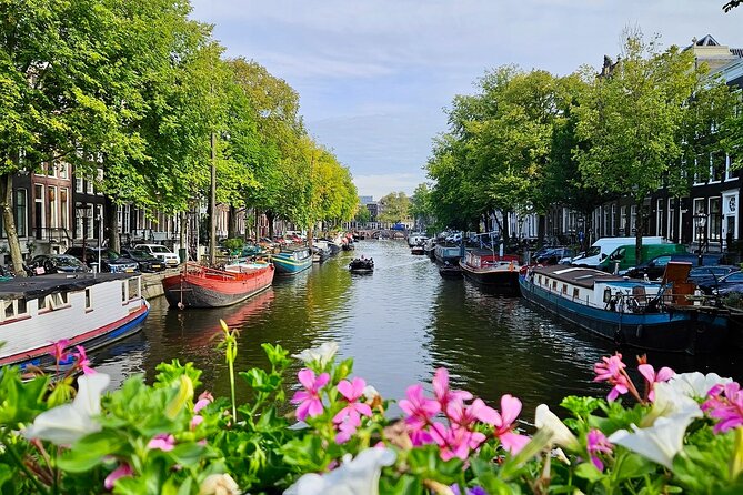 Private 90 Minute Amsterdam Canal Belt Exploration Cruise - Munt Tower and the flower market