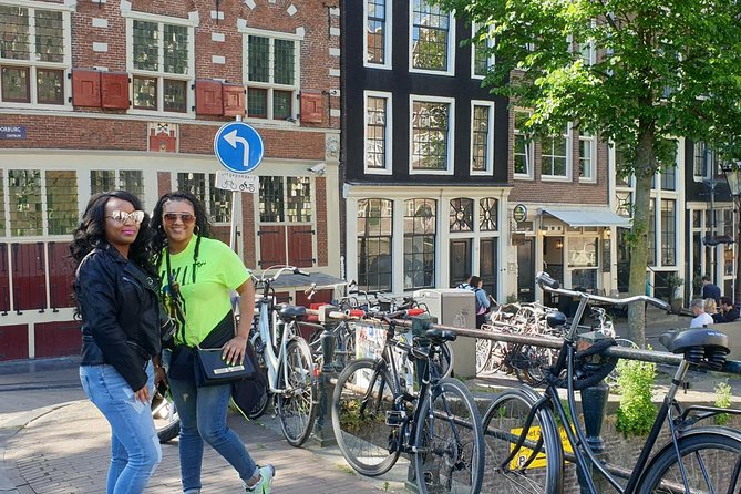 Private Amsterdam Red Light District tour with food tastings - Dam Square and the city built on wooden poles