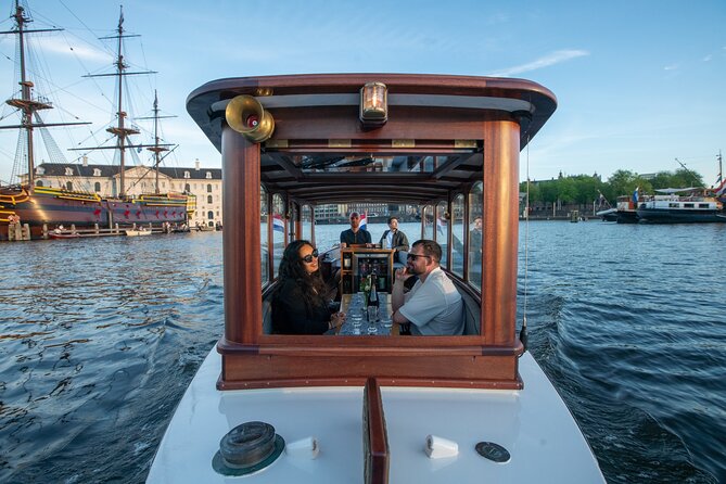 Private Boat Tour Amsterdam - 90 Min incl. welcome drink on historic saloon boat - Drinks, snacks, and the welcome aboard