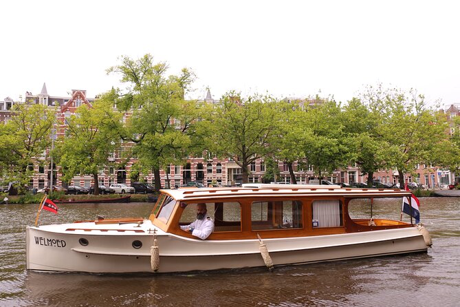 Private Champagne Canal Cruise in Amsterdam - The Amstel, locks, and the view toward the Amstel Hotel