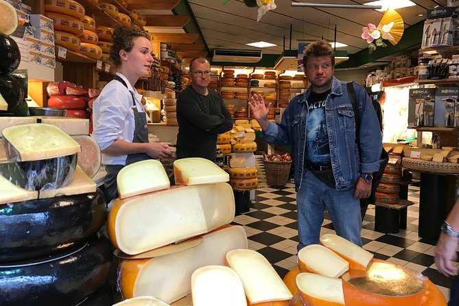 Private Walking Food Tour in Amsterdam - Stop one: cheese, herring, smoked eel, and mustard
