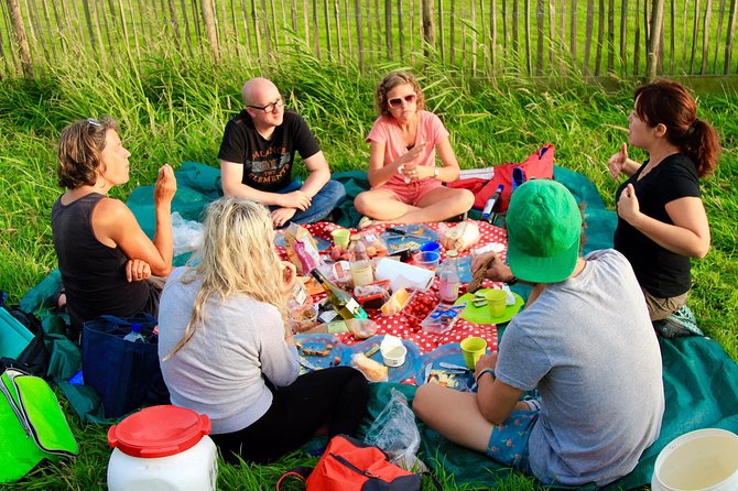 Small-Group Guided Sunset Canoe Tour in Waterland with Dinner - Paddling through Waterland’s reclaimed country