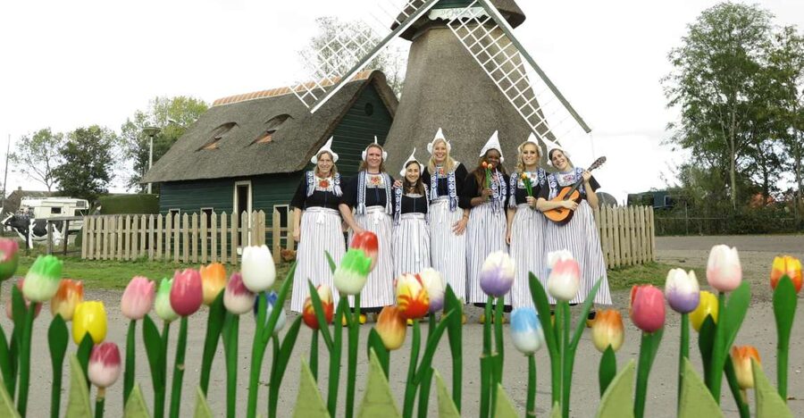Volendam: Traditional Costume Photo with Cheese & Clog Tour - The tasting table: stroopwafels, wine, and cheese