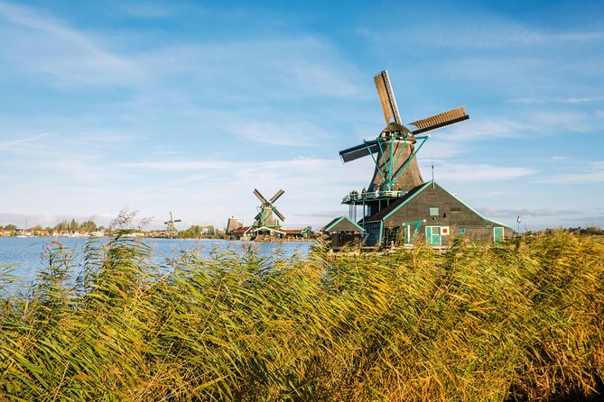 Windmill Tour from Amsterdam, Including Volendam & Marken - Zaanse Schans and the machinery behind the postcard